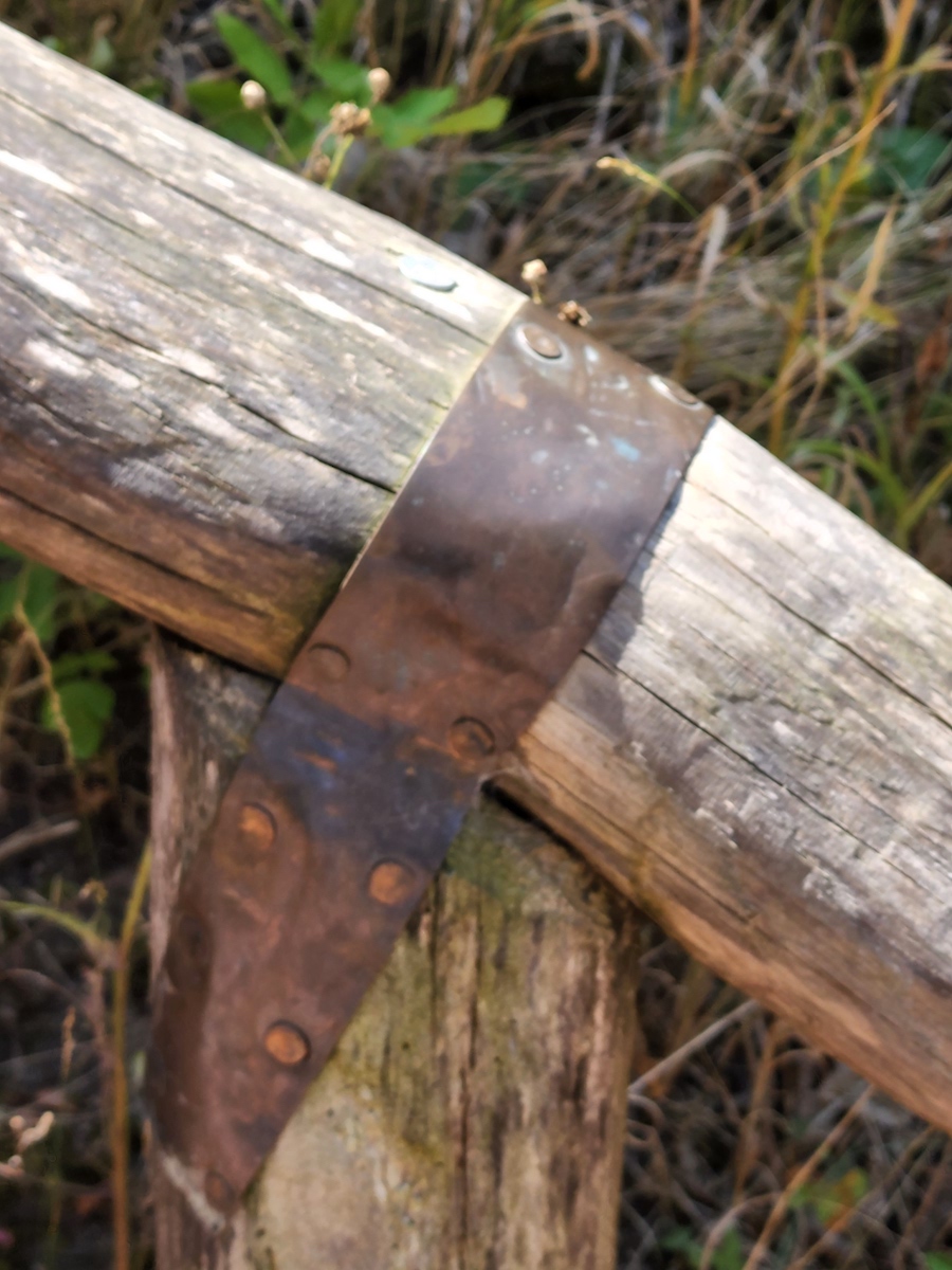 metal joinery on log